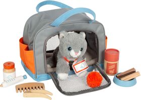 Katze mit Tasche und Pflege-Set